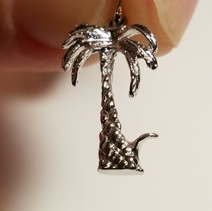 Sterling silver palm tree pendant.